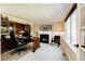 Executive office with fireplace, built-in shelving, and a large window at 22685 E Calhoun Pl, Aurora, CO 80016