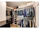 This spacious walk-in closet features custom shelving and ample storage at 22685 E Calhoun Pl, Aurora, CO 80016