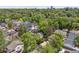 Aerial view of the neighborhood with tree lined streets and mature landscaping at 1459 S Elizabeth St, Denver, CO 80210