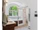 Elegant bathroom featuring double sinks, large tub, walk in shower and great natural light at 1459 S Elizabeth St, Denver, CO 80210