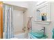 Bright bathroom with a stylish vanity, unique vessel sink, and classic tub-shower combination at 1459 S Elizabeth St, Denver, CO 80210