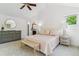 Bright bedroom with vaulted ceilings, comfortable bed, and view to bathroom at 1459 S Elizabeth St, Denver, CO 80210