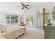 Bedroom with vaulted ceilings, carpet, dresser and view to balcony at 1459 S Elizabeth St, Denver, CO 80210