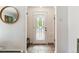 Entryway with tiled floor, a decorative front door, and a stylish round mirror at 1459 S Elizabeth St, Denver, CO 80210