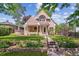 Charming two-story home with a landscaped yard, stone garden bed, and a welcoming front porch at 1459 S Elizabeth St, Denver, CO 80210