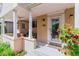 Inviting front porch with neutral colors, seating, and front door at 1459 S Elizabeth St, Denver, CO 80210