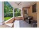 Covered front porch with ceiling fan, seating area, and view of the landscaped front yard at 1459 S Elizabeth St, Denver, CO 80210