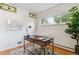 Inviting office area featuring hardwood floors, a modern desk, and a vibrant indoor plant at 1459 S Elizabeth St, Denver, CO 80210
