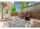Outdoor patio with flagstone flooring, seating area, and privacy fence for relaxing or entertaining at 1459 S Elizabeth St, Denver, CO 80210