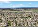 Wide aerial view showcasing the community, mountains, and the property's location at 3865 Rawhide Cir, Castle Rock, CO 80104