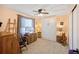 Cozy bedroom with neutral walls, murphy bed and a bright window at 3865 Rawhide Cir, Castle Rock, CO 80104