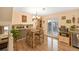 Cozy dining room with hardwood floors, chandelier lighting, and sliding glass doors to the back deck at 3865 Rawhide Cir, Castle Rock, CO 80104