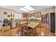 Spacious kitchen featuring an island, wood cabinets, stainless steel appliances, and hardwood floors at 3865 Rawhide Cir, Castle Rock, CO 80104