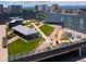 Scenic rooftop garden with lush greenery and an event tent in an urban setting at 55 W 12Th Ave # 510, Denver, CO 80204