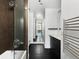 Modern bathroom featuring a glass shower, sleek vanity, and tiled floors at 55 W 12Th Ave # 510, Denver, CO 80204