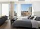 Bright bedroom featuring large windows, modern furniture, and city views at 55 W 12Th Ave # 510, Denver, CO 80204
