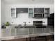 Bright kitchen with stainless steel island, modern gray cabinets, and stainless steel appliances at 55 W 12Th Ave # 510, Denver, CO 80204