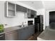 Modern kitchen featuring sleek gray cabinetry, stainless steel appliances, and white subway tile backsplash at 55 W 12Th Ave # 510, Denver, CO 80204