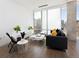 Contemporary living room boasts natural light, modern furnishings, and plants enhancing the bright atmosphere at 55 W 12Th Ave # 510, Denver, CO 80204