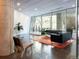 Bright and spacious lobby with modern furniture, concrete pillars, and floor-to-ceiling windows at 55 W 12Th Ave # 510, Denver, CO 80204