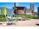 Inviting outdoor space with seating, garden, and a view of city buildings at 55 W 12Th Ave # 510, Denver, CO 80204