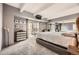 Comfortable bedroom with sliding glass doors to balcony and built in shelving at 7865 E Mississippi Ave # 602, Denver, CO 80247