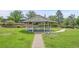 Picturesque gazebo on a lush green lawn with a stone walkway at 7865 E Mississippi Ave # 602, Denver, CO 80247