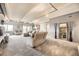 Spacious living room featuring recessed lighting, neutral tones, and balcony access at 7865 E Mississippi Ave # 602, Denver, CO 80247