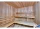 Wooden sauna with built in benches and horizontal wood paneling at 7865 E Mississippi Ave # 602, Denver, CO 80247