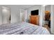 Bright bedroom features a neutral color palette, and an ensuite bath, and a large walk-in closet at 9635 Bellaire Ln, Thornton, CO 80229