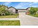 This home has great curb appeal, nice landscaping, stone accents, and an attached two-car garage at 9635 Bellaire Ln, Thornton, CO 80229