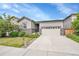 Charming one-story home with a well-manicured lawn and inviting front entrance and two-car garage at 9635 Bellaire Ln, Thornton, CO 80229