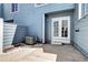 Small backyard featuring a patio area, perfect for outdoor dining, and a newly installed A/C unit at 1907 S Balsam St, Lakewood, CO 80227