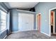 Inviting bedroom with a closet, large window for natural light, and neutral-colored walls at 1907 S Balsam St, Lakewood, CO 80227
