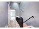 Hallway with vaulted ceiling, leading to the bedrooms and bath, offers a bright and airy atmosphere at 1907 S Balsam St, Lakewood, CO 80227
