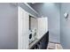 Convenient upper-level laundry closet equipped with a washer and dryer, and extra storage at 1907 S Balsam St, Lakewood, CO 80227