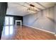 Spacious living room with hardwood floors, a fireplace, and natural light at 1907 S Balsam St, Lakewood, CO 80227