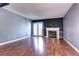 Spacious living room featuring hardwood floors, fireplace and French doors at 1907 S Balsam St, Lakewood, CO 80227