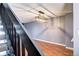 View of dining room light fixture from staircase at 1907 S Balsam St, Lakewood, CO 80227