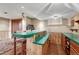 Basement wet bar featuring a bar seating, shelving, and wood paneled walls at 7425 S Dexter St, Centennial, CO 80122