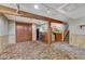 Cozy finished basement with bar, carpet, and stairs to another level at 7425 S Dexter St, Centennial, CO 80122