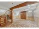 Finished basement features wood paneling, carpeting, and a small bar area at 7425 S Dexter St, Centennial, CO 80122