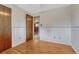 Empty bedroom with wood floors and adjoining room at 7425 S Dexter St, Centennial, CO 80122