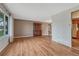 Spacious living room featuring hardwood floors, neutral wall colors, large window, and natural light at 7425 S Dexter St, Centennial, CO 80122