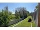 Lush backyard with green grass, mature trees, and a tall privacy fence at 12225 E 2Nd Dr, Aurora, CO 80011