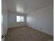 Bedroom with beige carpet and natural light at 8791 Chase Dr # 220, Arvada, CO 80003