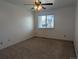 Spacious bedroom with a ceiling fan and natural light from the window at 8791 Chase Dr # 220, Arvada, CO 80003