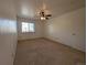 Spacious bedroom with neutral carpet, ceiling fan and a window with natural light at 8791 Chase Dr # 220, Arvada, CO 80003