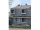 This townhome boasts a freshly painted exterior with white trim and a welcoming front entrance at 8791 Chase Dr # 220, Arvada, CO 80003