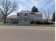 A well kept townhome with green grass and minimal landscaping at 8791 Chase Dr # 220, Arvada, CO 80003